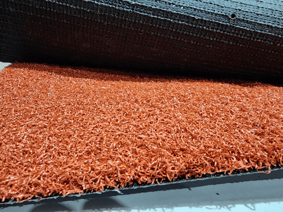 18mm Hockey Grass - Terracotta - 3.75m wide sold per Lm - Aloro Group